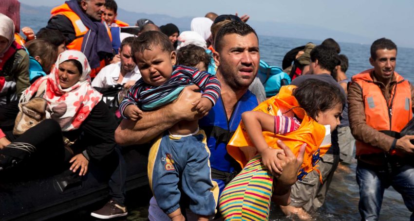 FILE - In this Sept. 10, 2015 file photo, Syrian refugees arrive aboard a dinghy after crossing from Turkey to the island of Lesbos, Greece. More than 76 years later, fresh angst about whether to admit refugees or turn them away has put the spotlight back on the 1939 shunning of the St. Louis, an ocean line carrying more than 900 Jewish refugees trying to escape Europe and other, now widely regretted, decisions by U.S. officials before and during World War II. (AP Photo/Petros Giannakouris, File)